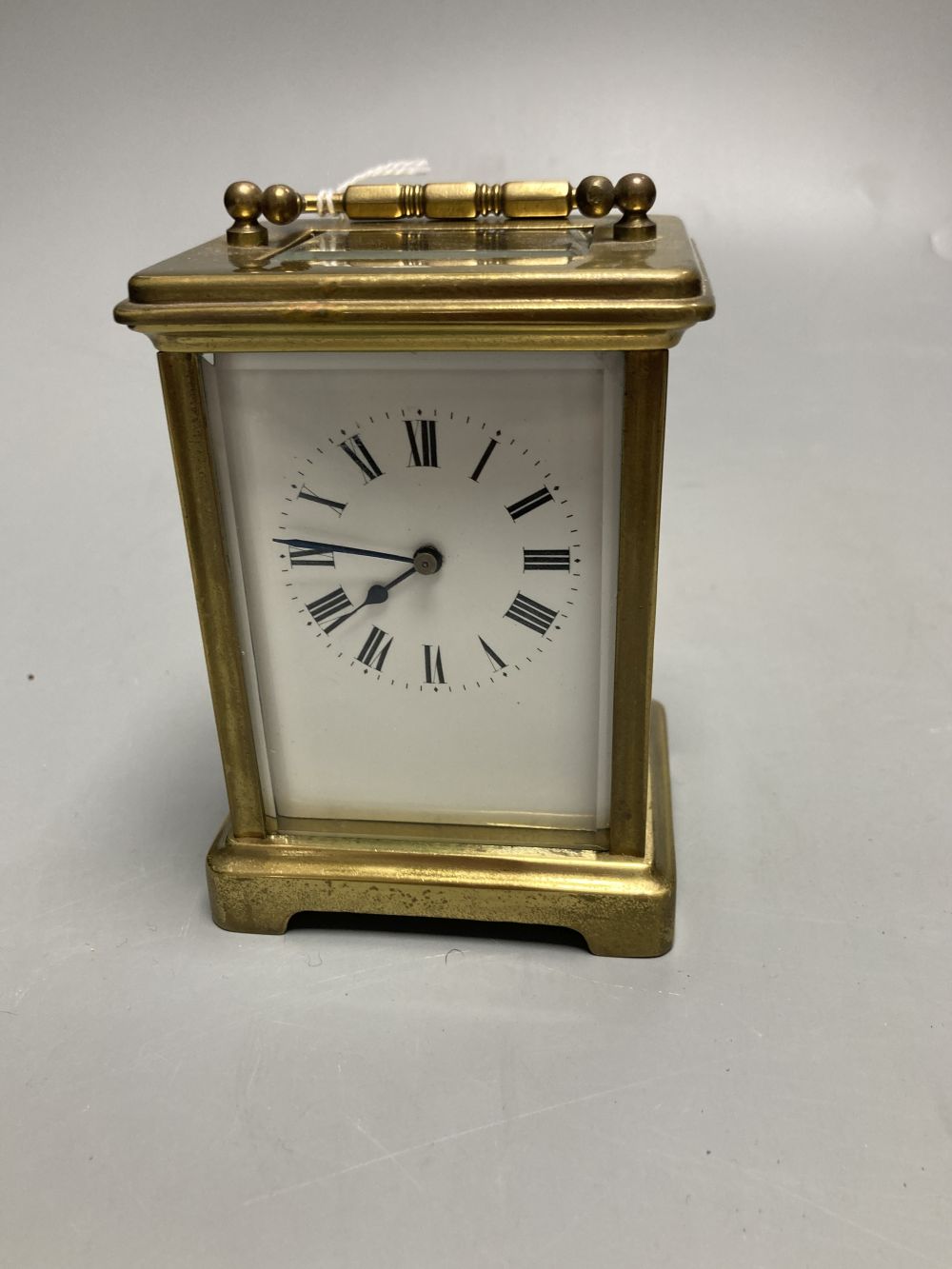 A gilt-brass carriage timepiece, with white enamelled Roman dial and outer travelling case and another carriage clock (2)